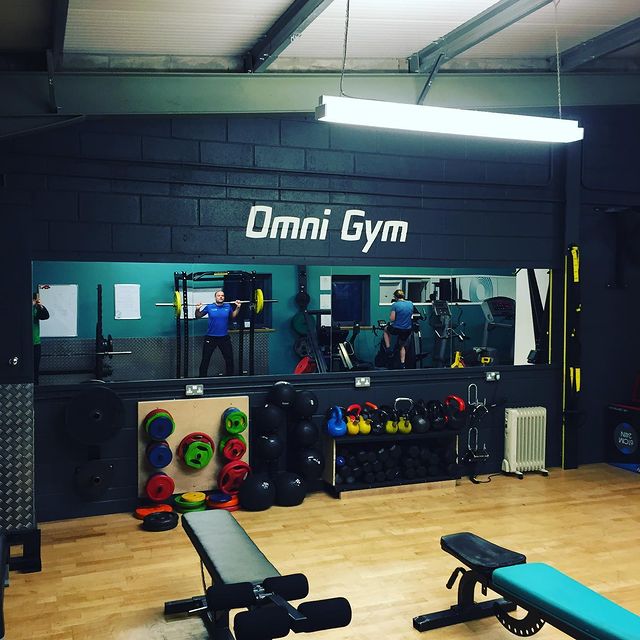 Omni gym mural on wall and mirror