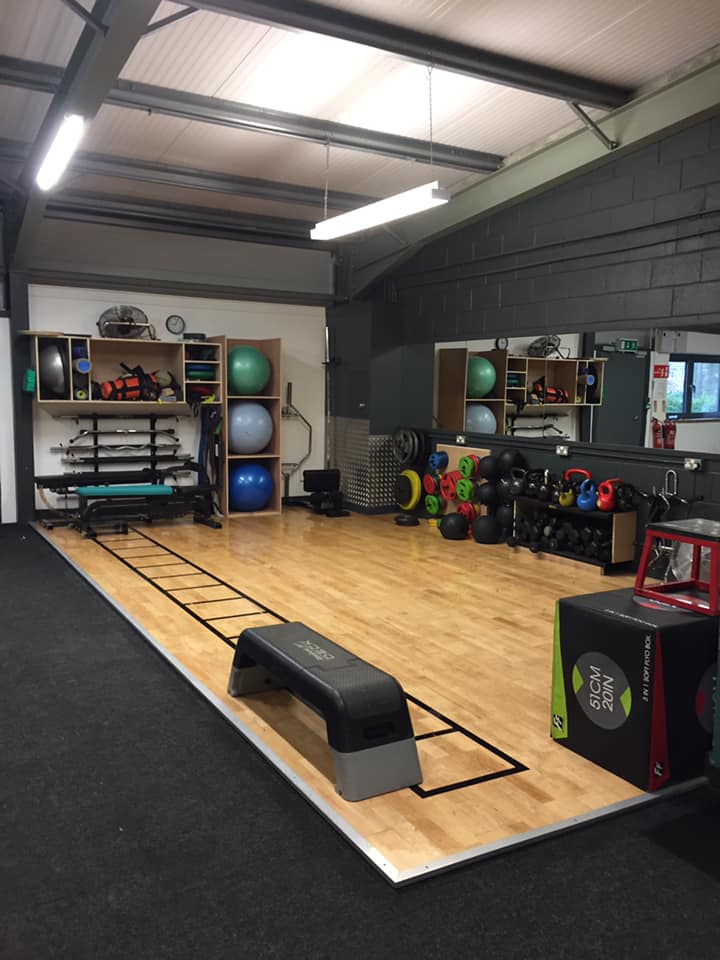 Gym floor with dumbbell's and benches