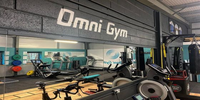 Omni gym mural on dark wall